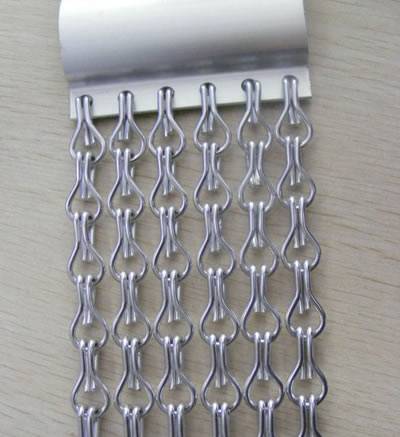 A small piece of aluminum chain link curtain with hanging system.