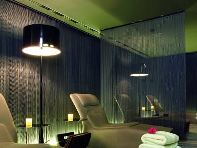 Aluminum chain link curtain is used as room divider at entertainment