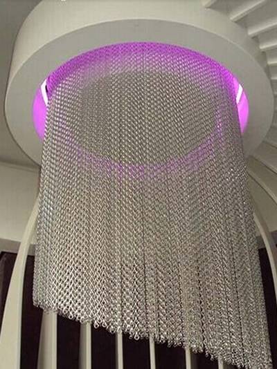 White chain link curtain is used as lampshade.