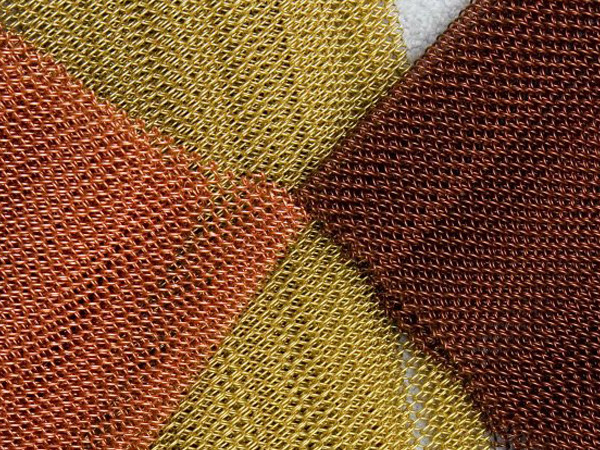 Three colors of metal coil drapery.