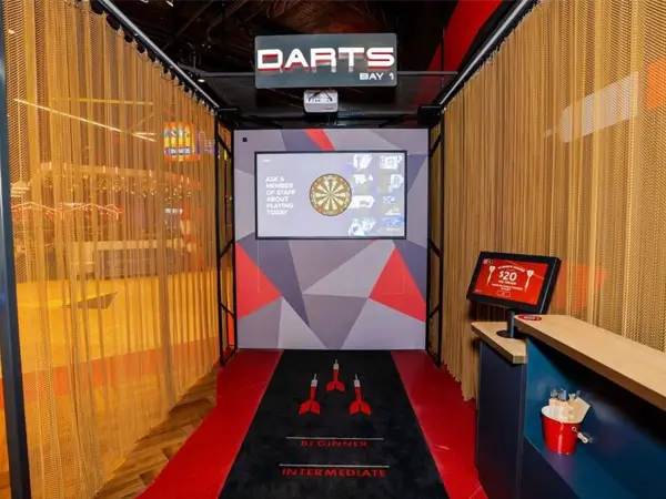 The family entertainment center is decorated with yellow metal coil drapery.