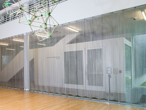 Metallic curtain separates the office areas.