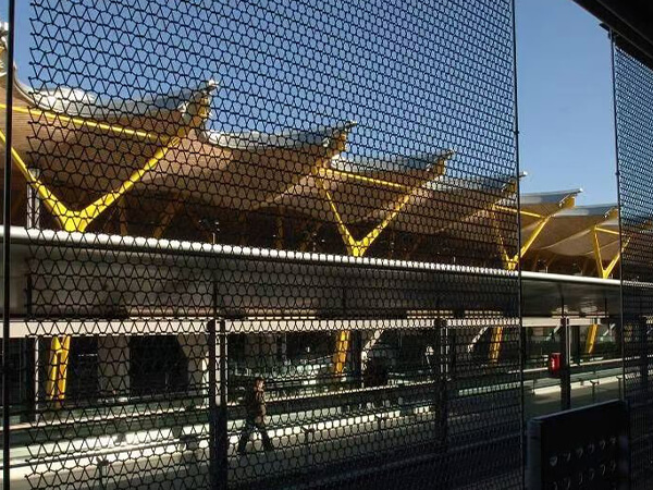 Metal curtains used as protective partitions on station platform