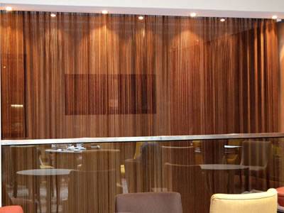 Copper metallic curtain gama flexi are installed in the restaurant and divide two parts.