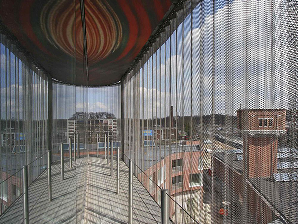 The corridor decorated with stainless steel metal coil drapery on both sides
