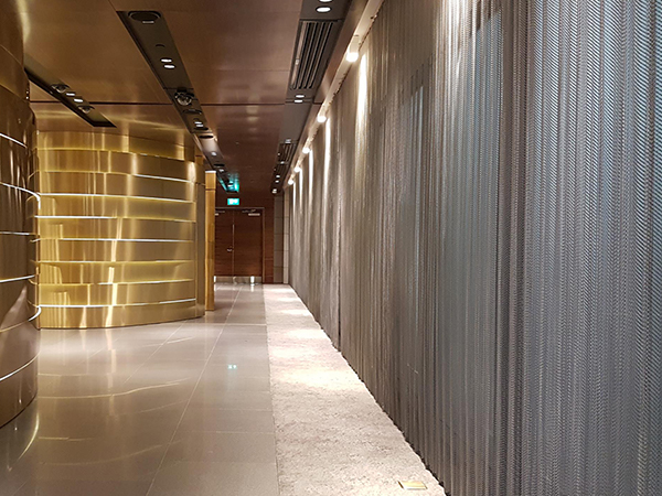 Stainless steel metal coil drapery for wall decoration in the gallery