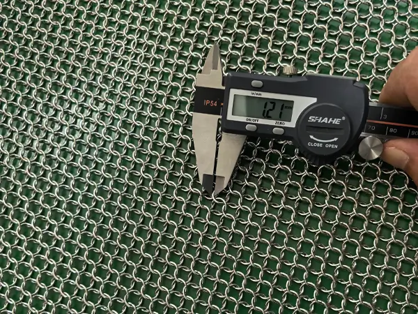 Measure the stainless steel welded chainmail curtain wire diameter with a caliper