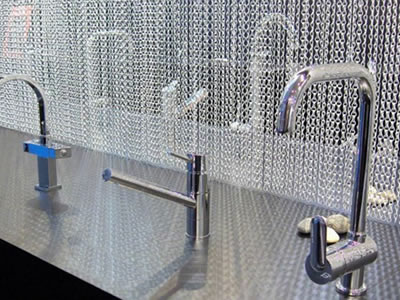 Chain link curtain is installed at washroom as a divider