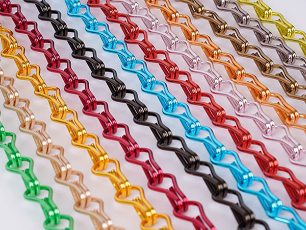 Anodized aluminum chain link curtain in 10 colors.