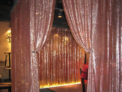 A green metal cloth curtain installed indoor as a divider