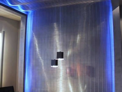Woven metal curtain with LEDs create an illustrious atmosphere.